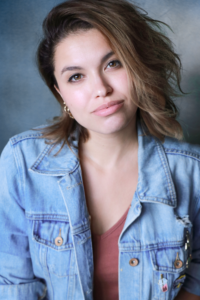ANNA DVORAK (she/her) as Judy Denmark